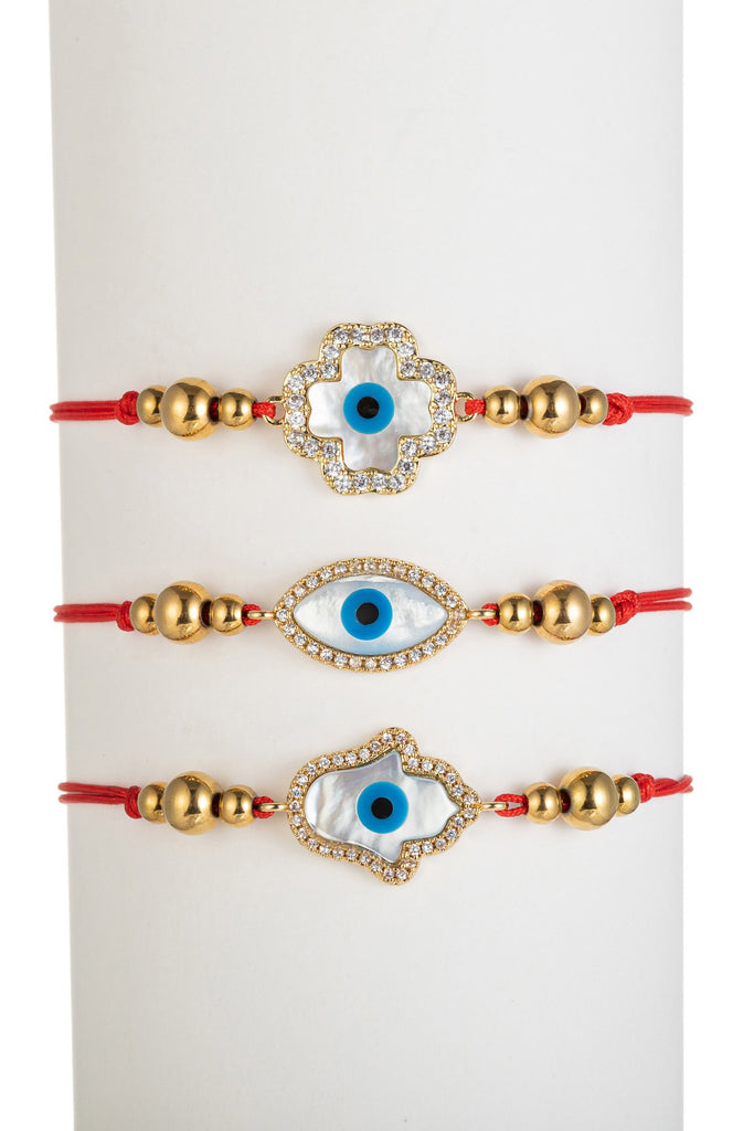 Red and gold bolo bracelet set with pendants studded with CZ crystals.