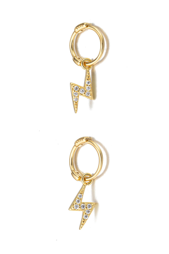 Gold sterling silver lightning bolt huggie earrings.