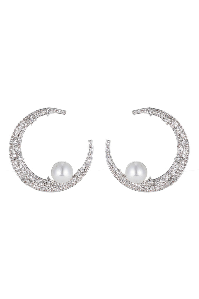 Silver crescent moon pearl earrings studded with CZ crystals. 