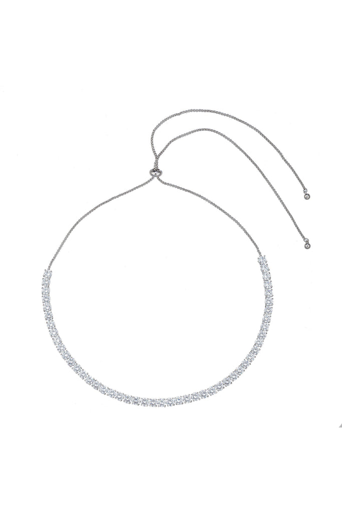 Silver tone brass tennis necklace studded with CZ crystals.